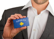 Businessman is holding a business card, Kosovo