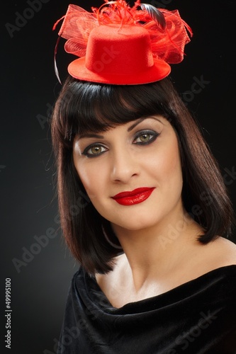 Photo: Portrait of young woman in red hat Portrait of young woman in red hat