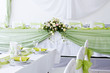 table set for wedding dinner decorated with flowers