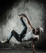 Young b-boy man doing brake dancing movements