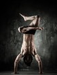 Photo: Young b-boy man with naked torso doing brake dancing movements Young b-boy man with naked torso doing brake dancing movements