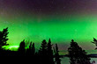 Green glow of Northern Lights or Aurora borealis