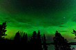 Green glow of Northern Lights or Aurora borealis