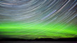 Star trails and Northern lights in night sky
