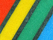 Colorful sponges for washing dishes. Abstract background.