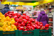 Photo: Bunch of red and yellow paprika peppers in supermarket Bunch of red and yellow paprika peppers in supermarket