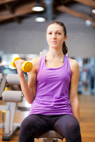 Photo: Woman lifting weights Woman lifting weights