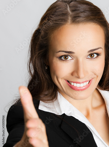 Photo: Businesswoman giving hand for handshake Businesswoman giving hand for handshake