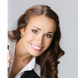 Businesswoman showing signboard, over gray