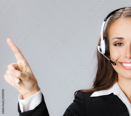 Photo: Support phone operator pointing, over grey Support phone operator pointing, over grey