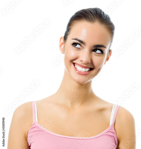 Photo: Portrait of young happy smiling thinking woman Portrait of young happy smiling thinking woman