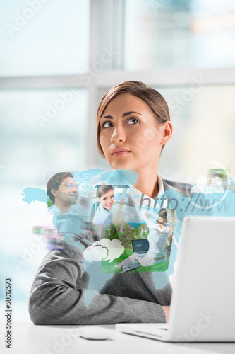 Photo: Business woman surfing on web with modern laptop Business woman surfing on web with modern laptop