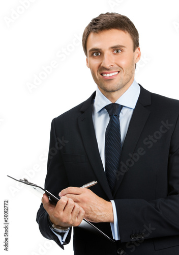 Photo: Businessman with clipboard writing, isolated Businessman with clipboard writing, isolated