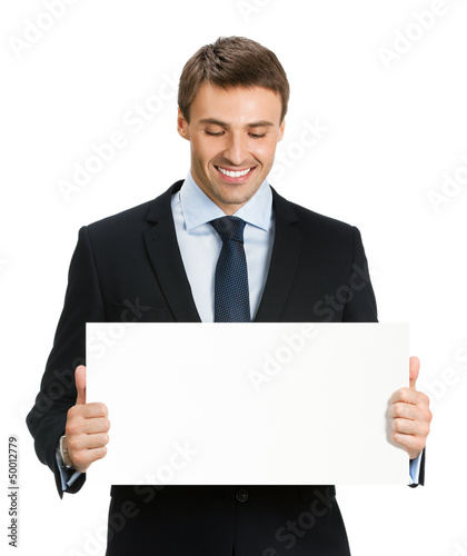 Photo: Businessman showing blank signboard, isolated Businessman showing blank signboard, isolated
