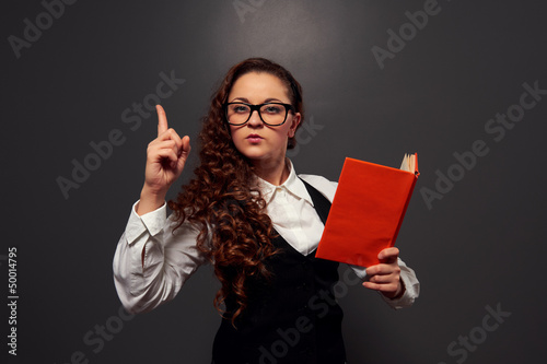 Photo: student in glasses holding book student in glasses holding book