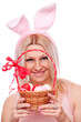 Woman holding punnet with Easter eggs