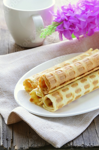 Photo: cookie wafer rolls on a plate cookie wafer rolls on a plate