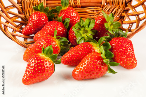 Photo: Strawberries with leaves. Isolated on a white background. Strawberries with leaves. Isolated on a white background.