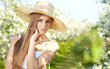 beautiful blonde in a spring garden