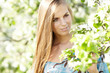 Photo: beautiful blonde in a spring garden beautiful blonde in a spring garden