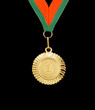 Gold medal with ribbon isolated on black