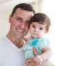 Happy young father with little daughter