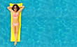 Woman relaxing in pool.
