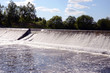 dam construction on river and waterfall