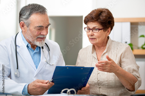 Photo: Patient tells the doctor about her health complaints Patient tells the doctor about her health complaints