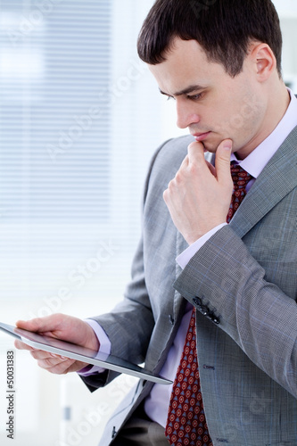 Photo: man in office man in office