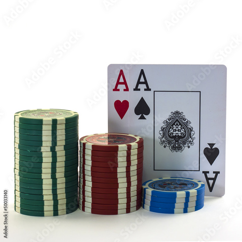 Photo: The poker cards with chips isolated in white The poker cards with chips isolated in white