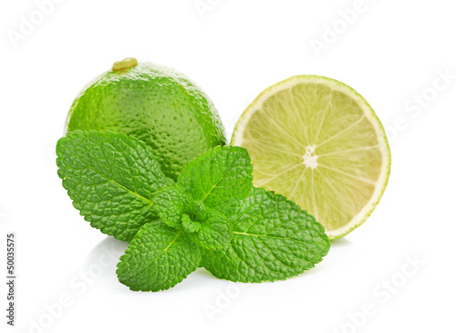 Photo: Limes and mint isolated on white background Limes and mint isolated on white background