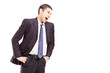 Photo: Angry young man in a suit shouting Angry young man in a suit shouting
