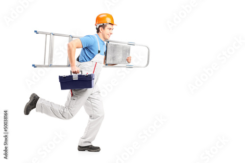 Photo: Full length portrait of a repairman running with a ladder and a Full length portrait of a repairman running with a ladder and a
