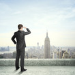 man looking at city