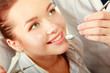 Young woman with dentist in a dental surgery