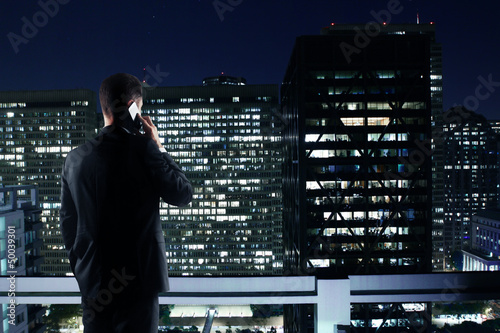 Photo: man looking to night city man looking to night city