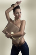 fashion brunette in jeans with big bag and hand on the head