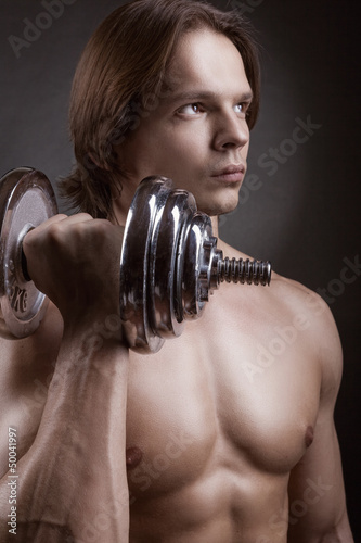 Photo: Exercising with dumbbell Exercising with dumbbell