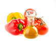 bottle with olive oil ,tomatoes and peppers on a white backgroun