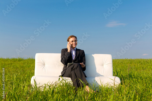 Photo: Business woman with touch pad and phone Business woman with touch pad and phone