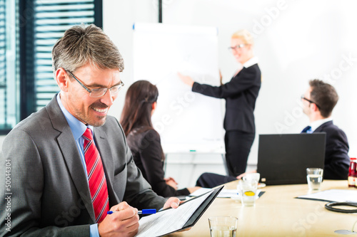 Photo: Business - businesspeople have team meeting Business - businesspeople have team meeting