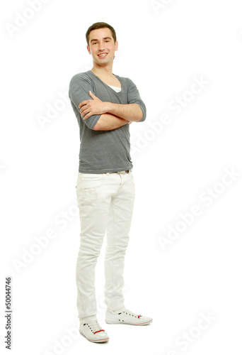 Photo: A handsome man standing isolated on white background A handsome man standing isolated on white background