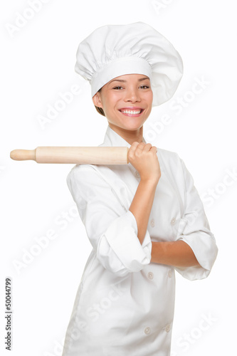 CONTENT::IMG::TITLE::Photo: Baker woman smiling proud with baking rolling pin Baker woman smiling proud with baking rolling pin