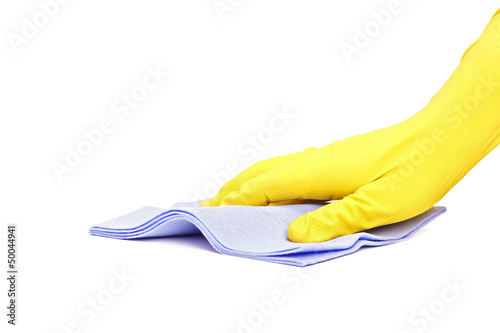 Photo: Studio shot of a hand with rubber glove wiping with a cloth Studio shot of a hand with rubber glove wiping with a cloth