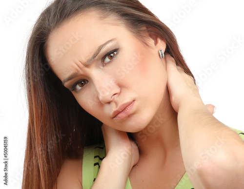 Photo: Young woman holding her neck because of pain Young woman holding her neck because of pain