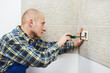 Photo: Electrician installing wall outlets Electrician installing wall outlets