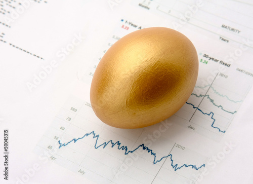 Photo: Gold egg on a diagramm Gold egg on a diagramm