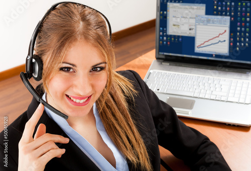 Photo: Smiling businesswoman at work Smiling businesswoman at work