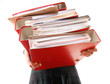 Photo: Female office worker carrying a stack of files Female office worker carrying a stack of files